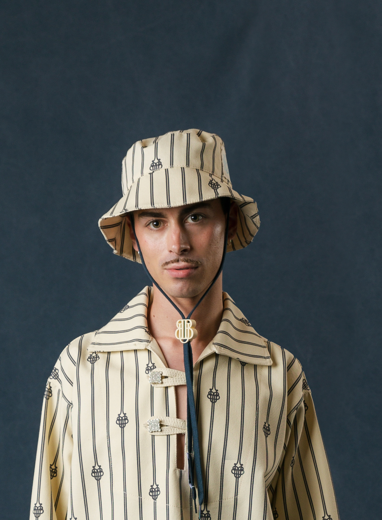 UB MONOGRAM SHORT ROPE BUCKET HAT