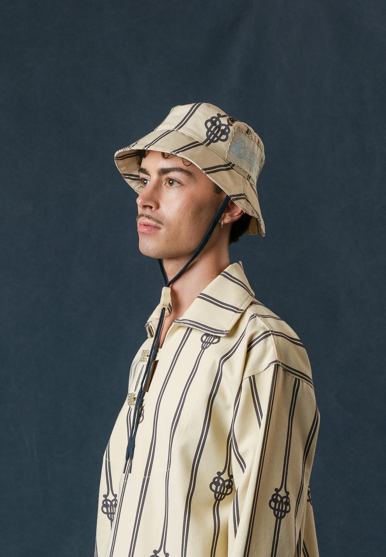 UB MONOGRAM LARGE ROPE BUCKET HAT